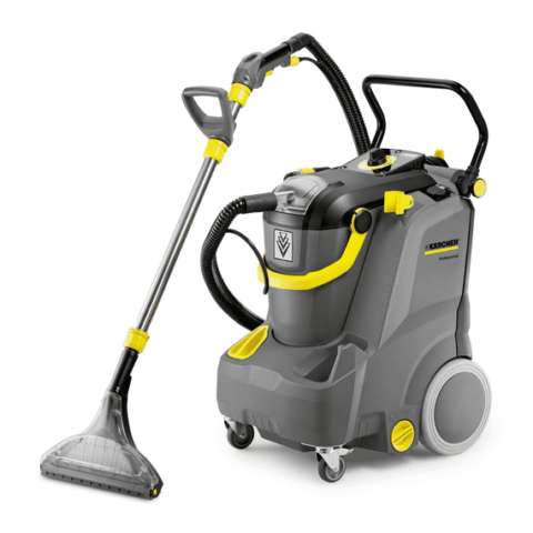 A Spray Extraction Cleaner Puzzi 30/4 professional carpet cleaner with grey and yellow design, featuring a handle and wheels for mobility, alongside an attached cleaning wand and hose.