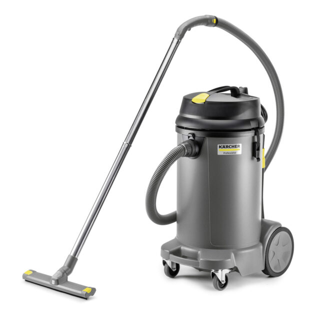 A Wet And Dry Vacuum Cleaner NT 48/1 with a silver cylindrical body, black hose, and attached floor nozzle, set on wheels for mobility, isolated on a white background.