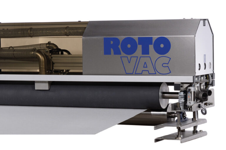 A modern industrial carpet cleaning machine, labeled "roto vac," featuring a large cylindrical brush and a gray metallic housing.
