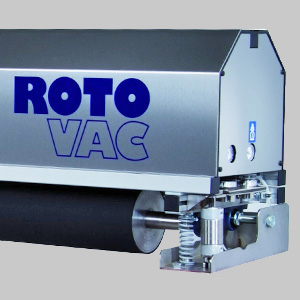 Close-up view of a silver industrial vacuum machine labeled "roto vac" with visible parts of its chrome mechanical components.
